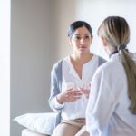 Woman speaking with doctor