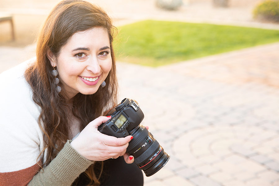 Photographer Chelsey Nelson is seen outside with her camera