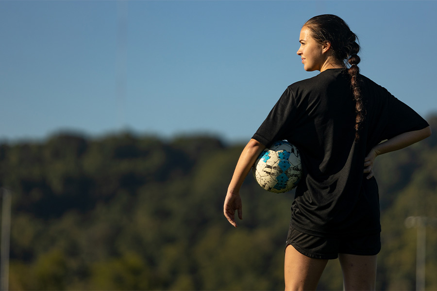 Lainey Armistead is seen standing with a soccer ball