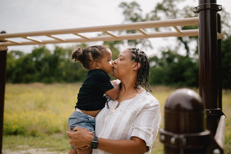 Sharonell Fulton is seen holding a child at a playground