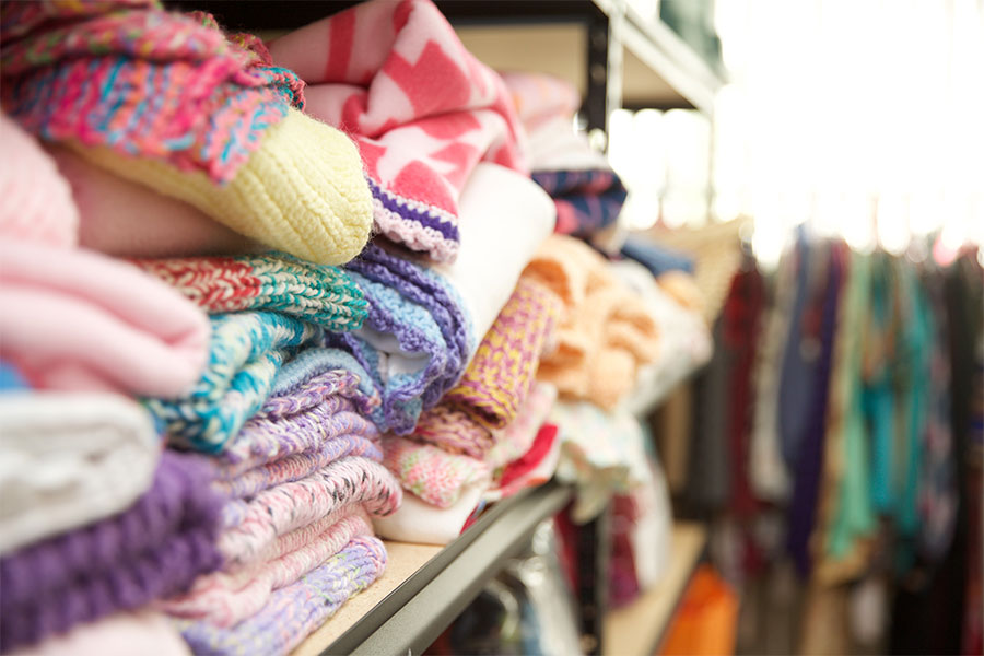 Stacks of baby clothes are seen at a pregnancy center