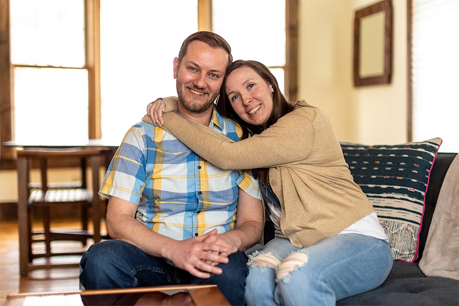 Katy Wuoti hugs her husband, Brian